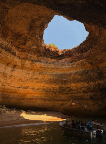 The interior beach of Benagil Cave seen from a boat