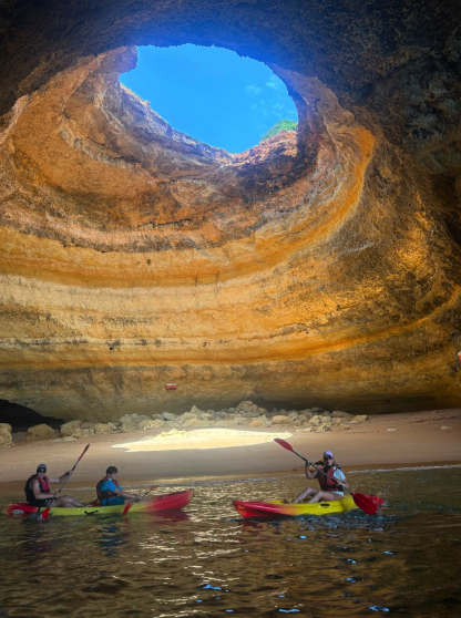 A guided kayak group at the cliffs near Benagil